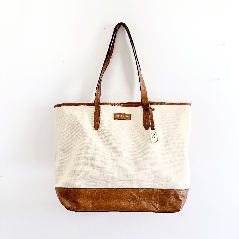 COLE HAAN IVORY CANVAS SHOULDER BAG WITH LEATHER AND GOLD DETAIL